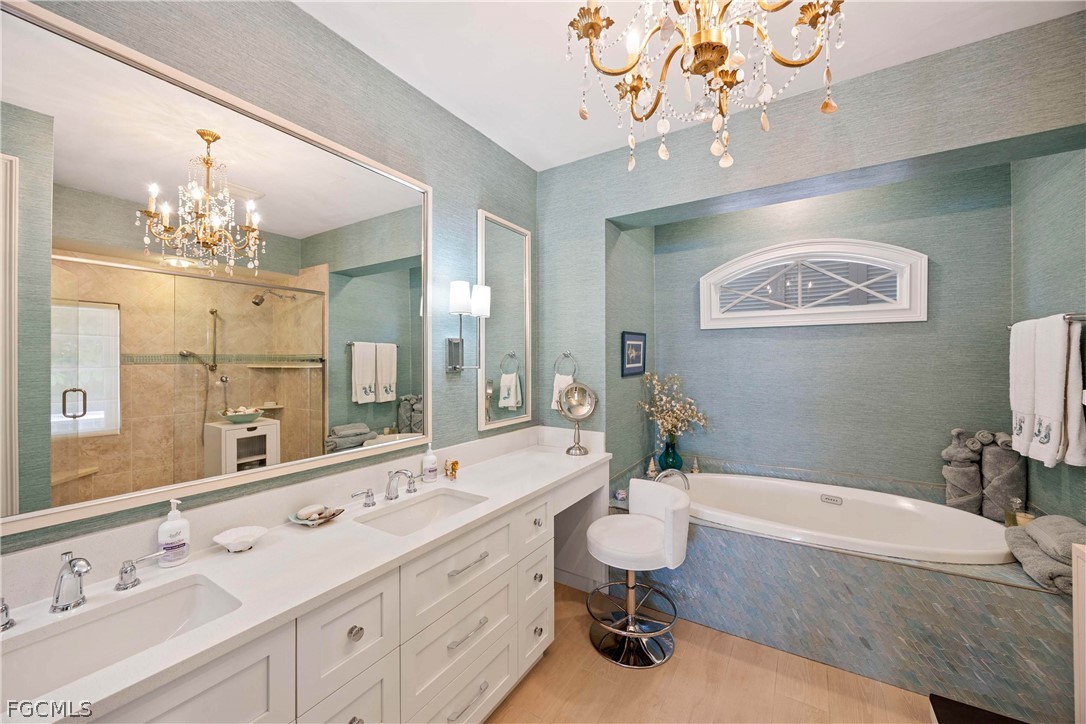 528 Lighthouse Way Sanibel, FL 33957 - Photo 26 of 49 a bathroom with a tub sink and mirror