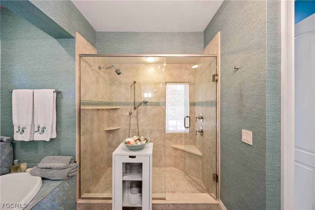 528 Lighthouse Way Sanibel, FL 33957 - Photo 27 of 49 a bathroom with a sink a toilet and shower
