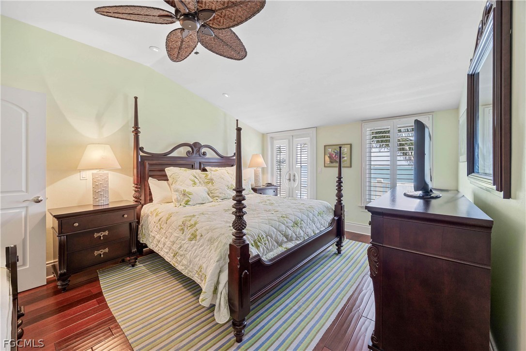 528 Lighthouse Way Sanibel, FL 33957 - Photo 33 of 49 a bedroom with a bed and wooden floor