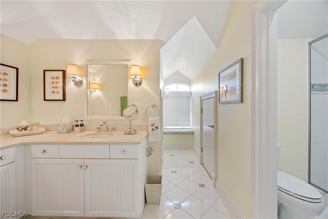 528 Lighthouse Way Sanibel, FL 33957 - Photo 34 of 49 a bathroom with a granite countertop sink mirror and double