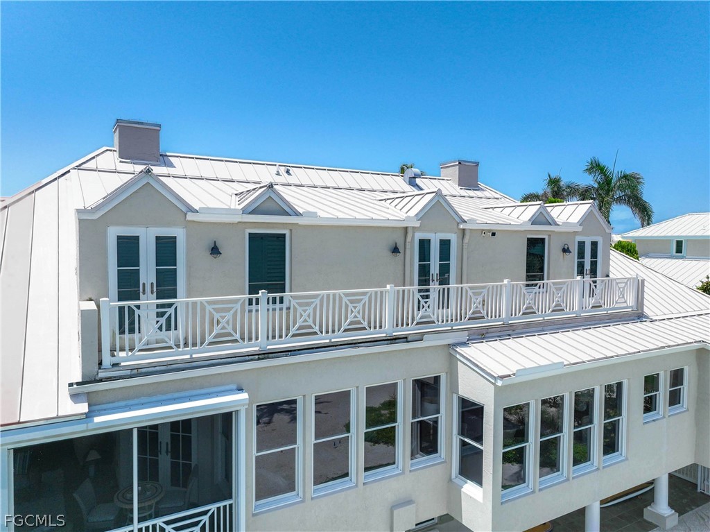 528 Lighthouse Way Sanibel, FL 33957 - Photo 43 of 49 a front view of a residential apartment building with a windows