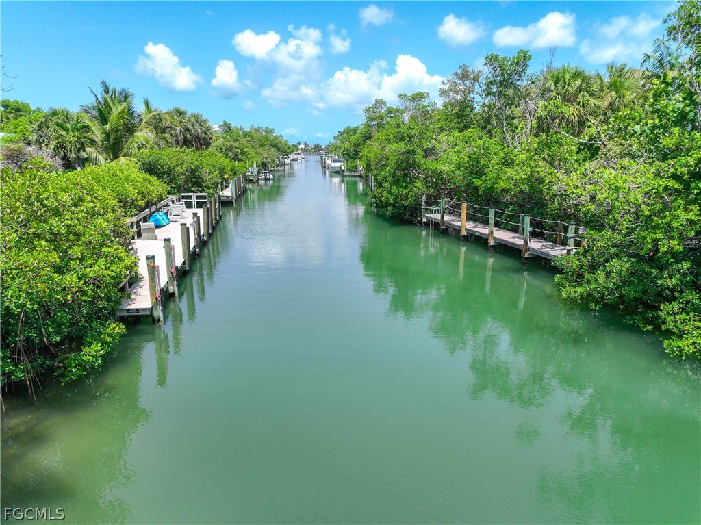 528 Lighthouse Way Sanibel, FL 33957 - Photo 47 of 49 a view of a lake with a yard