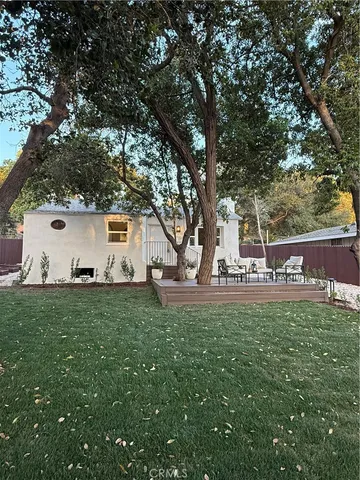 a view of a patio with couches and potted plants