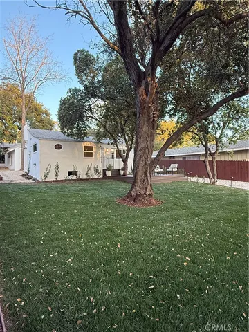 a view of a house with swimming pool and sitting area