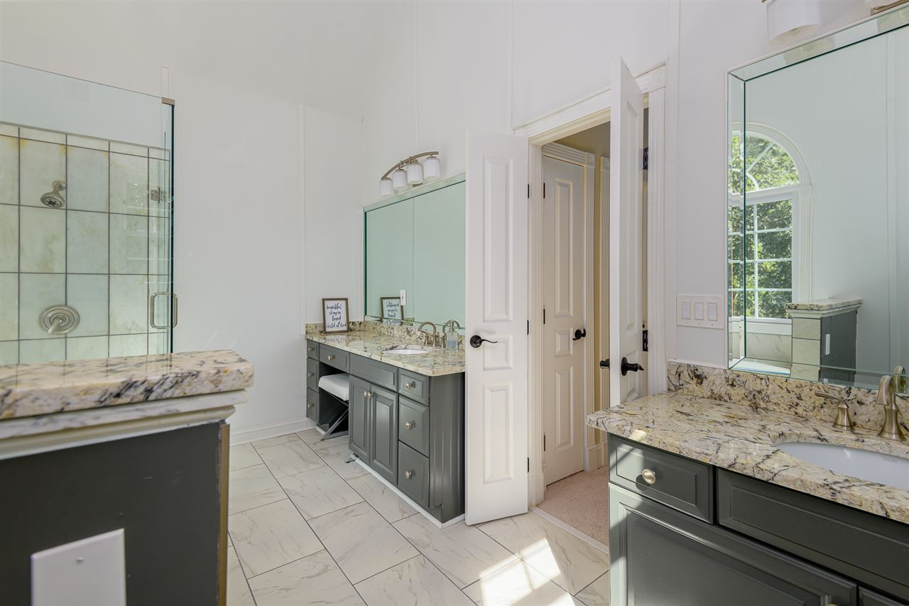 1000 Streeter Lane Raleigh, NC 27614 - Photo 15 of 30 a bathroom with a granite countertop sink and a mirror