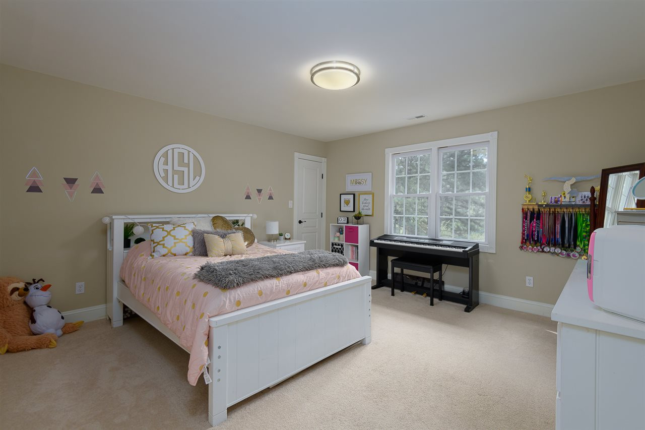1000 Streeter Lane Raleigh, NC 27614 - Photo 17 of 30 a bed room with a bed and a table