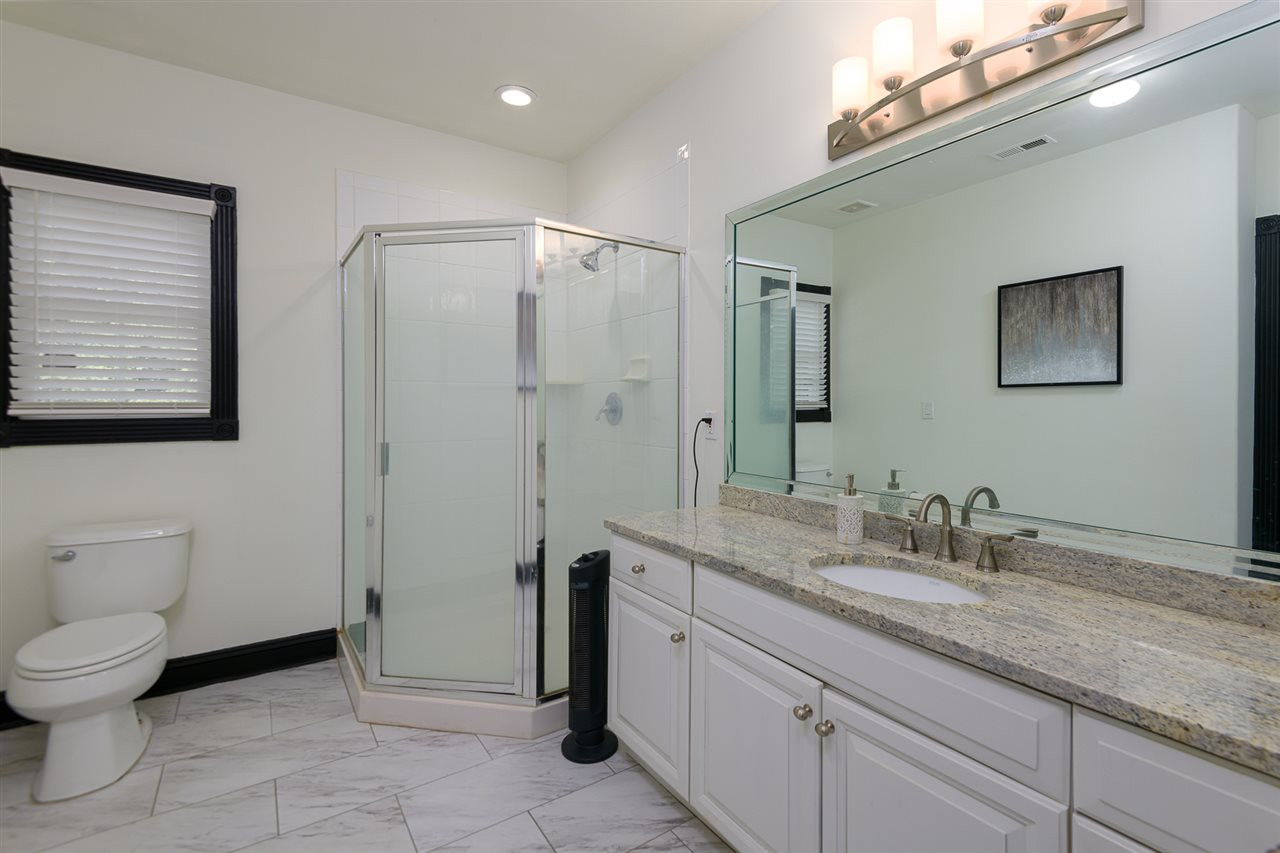 1000 Streeter Lane Raleigh, NC 27614 - Photo 24 of 30 a spacious bathroom with a granite countertop sink a toilet and a mirror