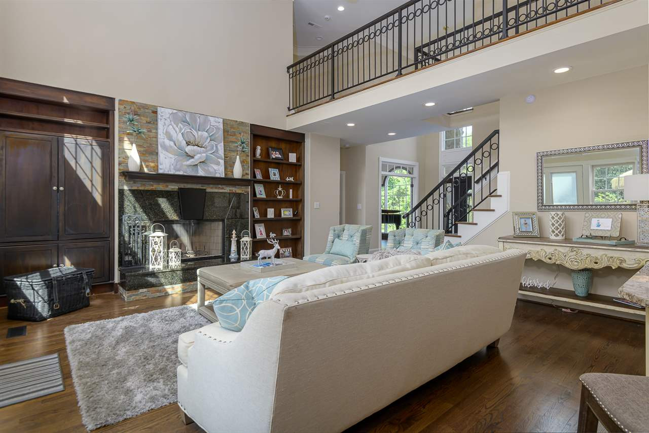 1000 Streeter Lane Raleigh, NC 27614 - Photo 8 of 30 a living room with furniture a large window and wooden floor