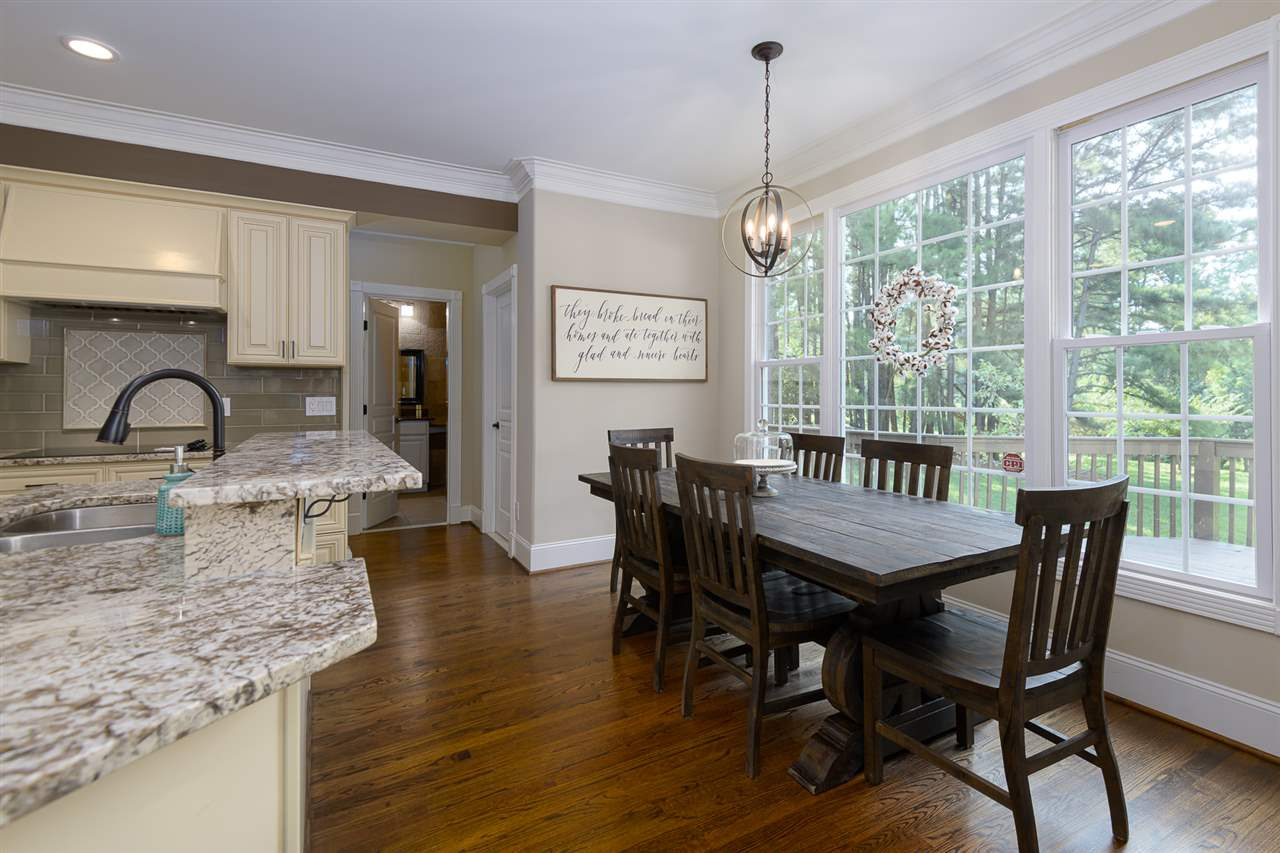 1000 Streeter Lane Raleigh, NC 27614 - Photo 9 of 30 a dining room with furniture a chandelier and wooden floor