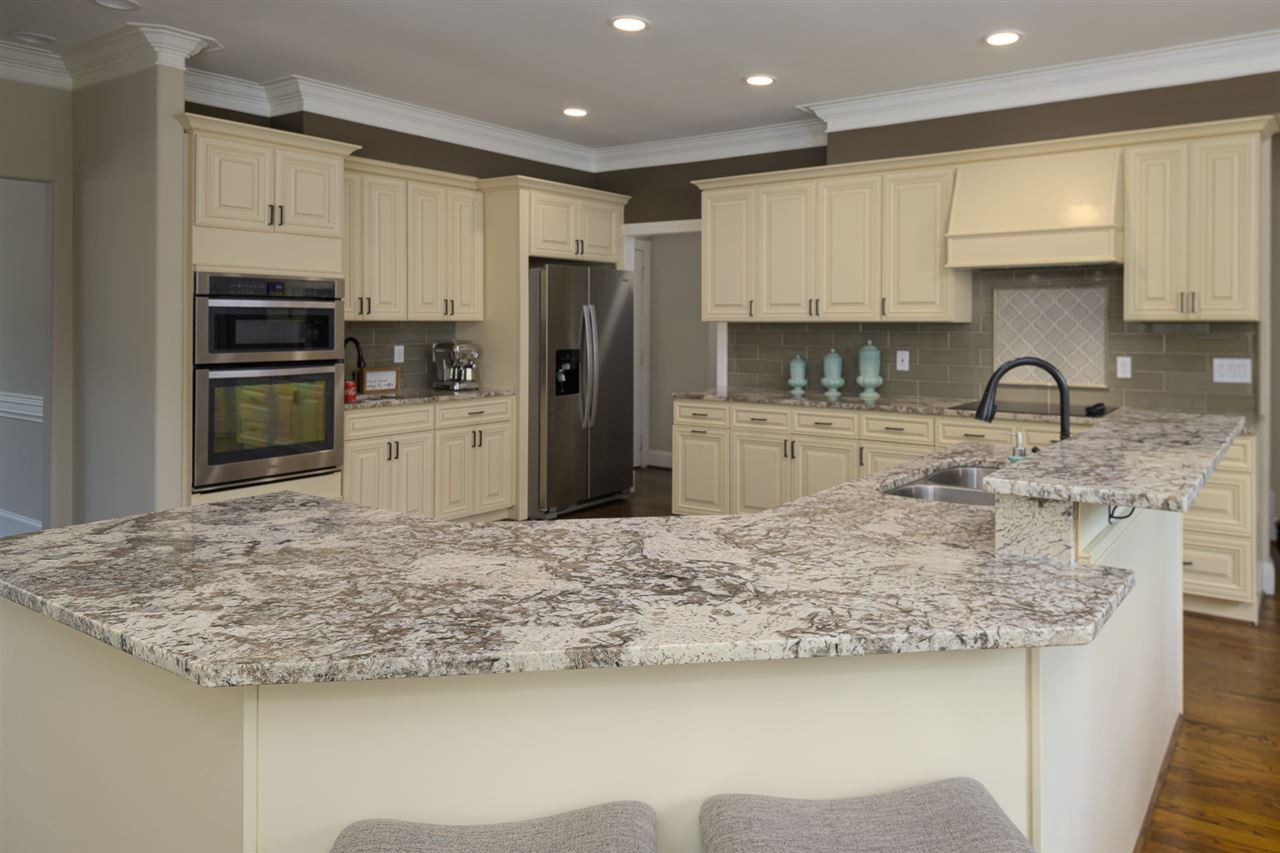 1000 Streeter Lane Raleigh, NC 27614 - Photo 10 of 30 a kitchen with stainless steel appliances granite countertop a sink refrigerator and cabinets