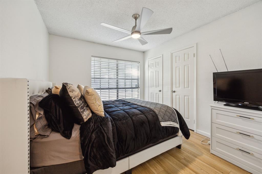 226 East Ridgegate Drive Garland, TX 75040 - Photo 19 of 25 a bedroom with a bed and a flat screen tv