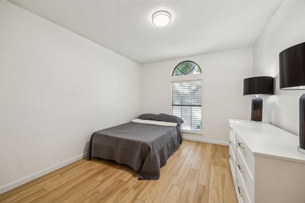 226 East Ridgegate Drive Garland, TX 75040 - Photo 20 of 25 a bedroom with a bed and a window
