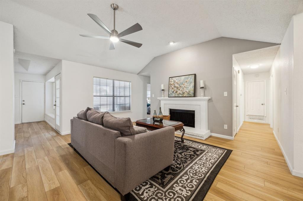 226 East Ridgegate Drive Garland, TX 75040 - Photo 7 of 25 a living room with furniture and a fireplace