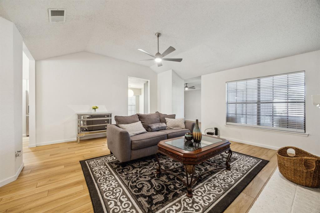 226 East Ridgegate Drive Garland, TX 75040 - Photo 8 of 25 a living room with furniture and a rug