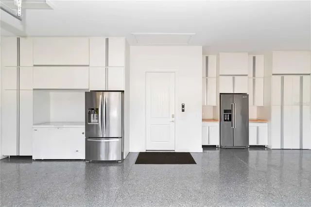 a living room with furniture a dining table and a flat screen tv