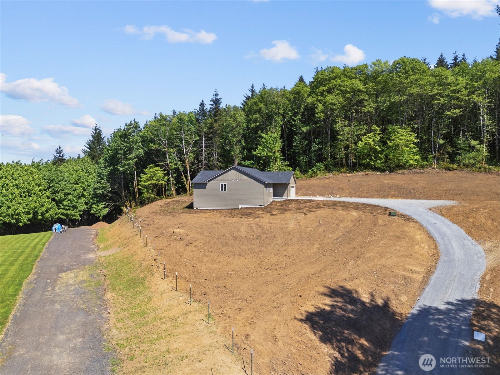 254 Windy Ridge Drive Longview, WA 98632 - Photo 24 of 27 a view of a swimming pool and trees in the background