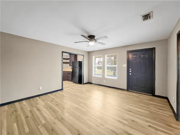 a view of an empty room with a window