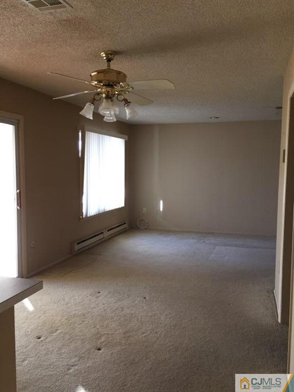 440 B Belford Road Monroe Township, NJ 08831 - Photo 2 of 13 a view of an empty room with a window
