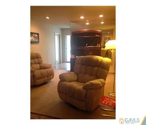 440 B Belford Road Monroe Township, NJ 08831 - Photo 8 of 13 a living room with furniture and a fireplace