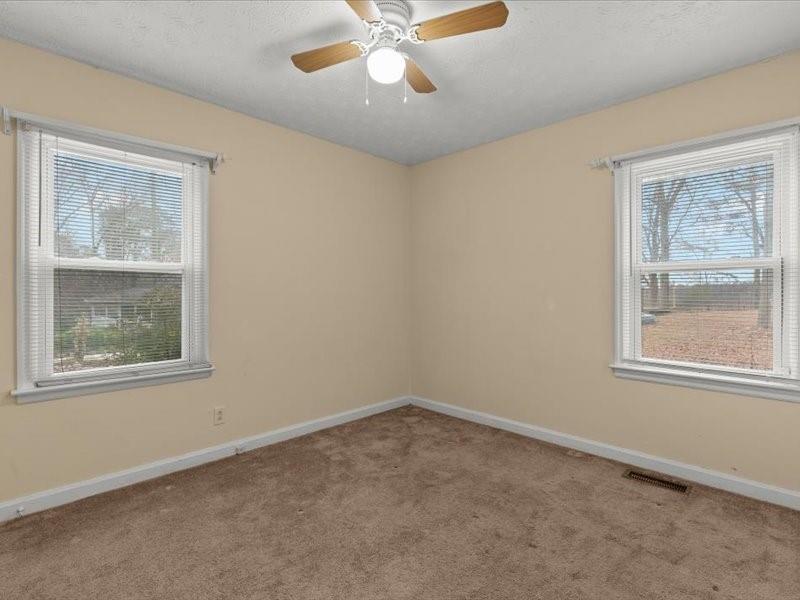 4624 Macland Road Hiram, GA 30141 - Photo 17 of 30 an empty room with a window and a fan