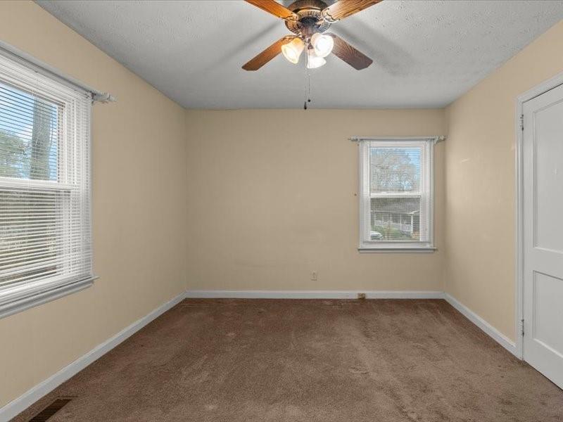 4624 Macland Road Hiram, GA 30141 - Photo 19 of 30 an empty room with windows and fan