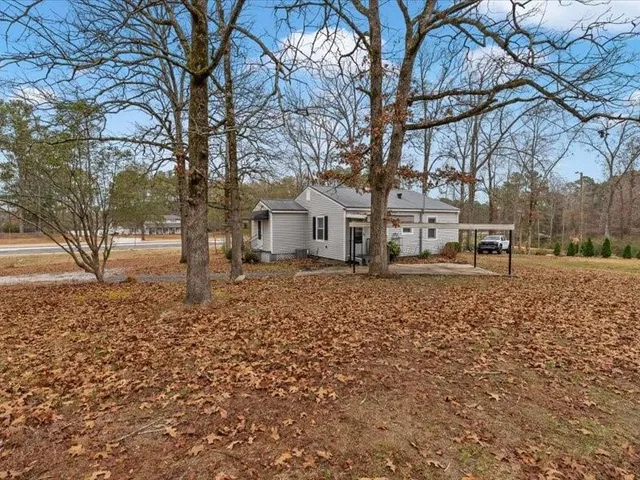 a backyard of a house with trees