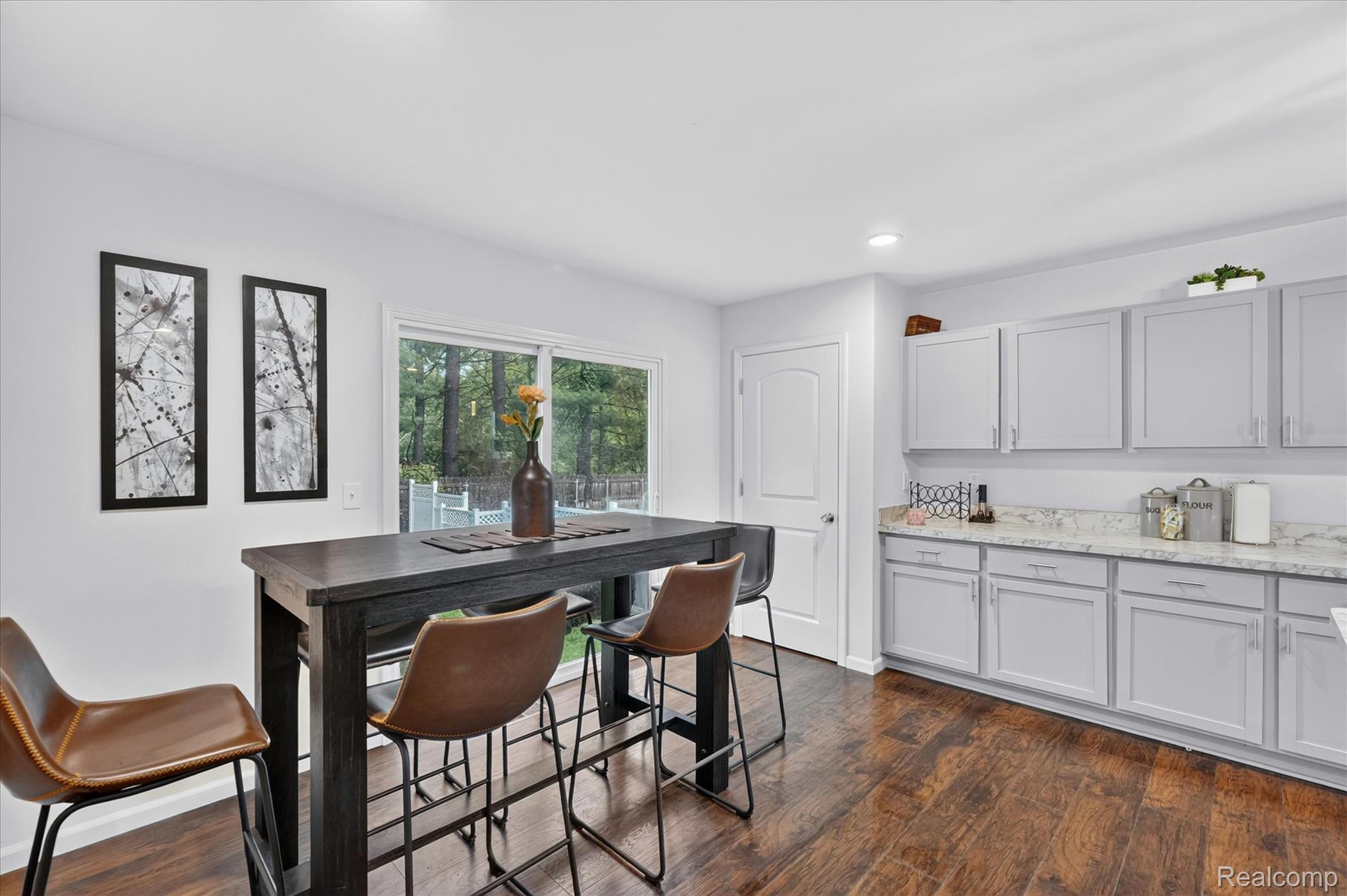 5382 Rural Terrace Waterford, MI 48329 - Photo 10 of 35 Kitchen area featuring wood-finish flooring, white walls, and a recessed ceiling light