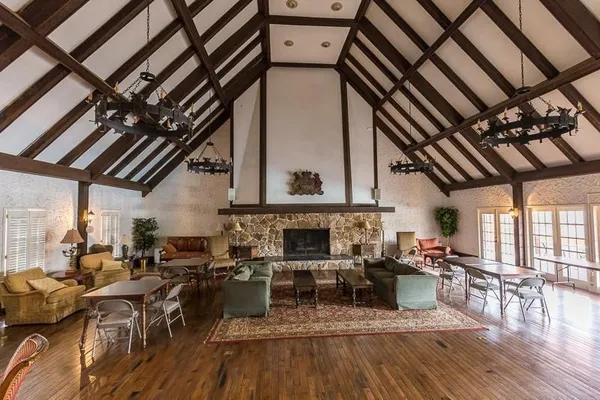 a dining room with furniture a chandelier