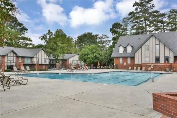an aerial view of a house with swimming pool garden and patio