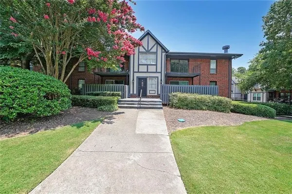 a front view of a house with yard