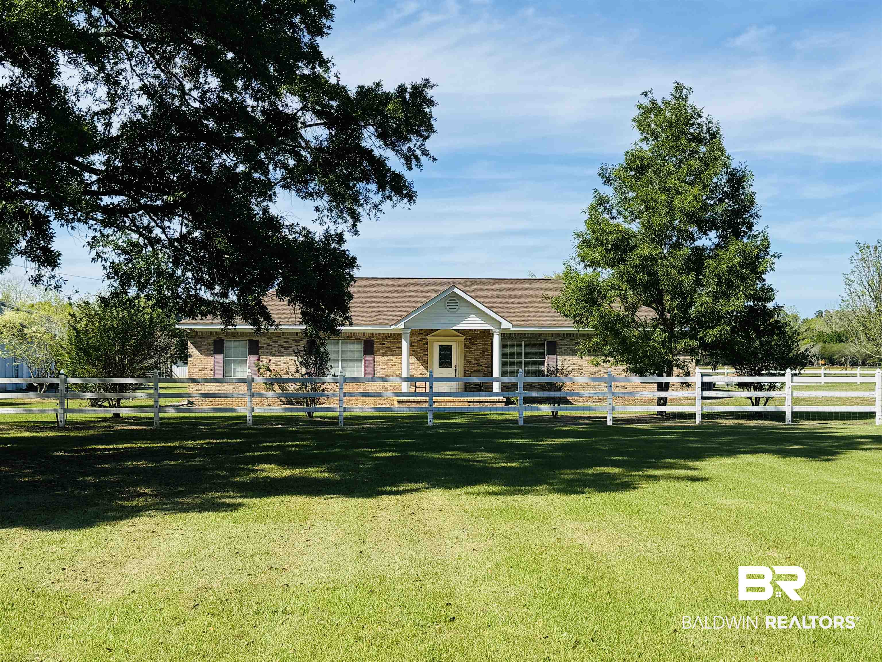 13795 White Road Silverhill, AL 36576 - Photo 10 of 99 View of front facade featuring a fenced front yard and brick siding