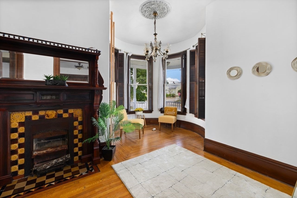 311 Elm Street Woonsocket, RI 02895 - Photo 11 of 29 a living room with furniture and a fireplace
