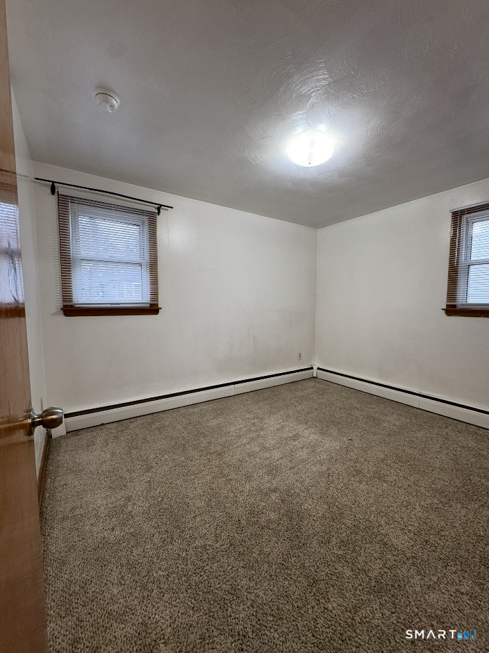 16 Grove Street New London, CT 06320 - Photo 12 of 12 a view of an empty room