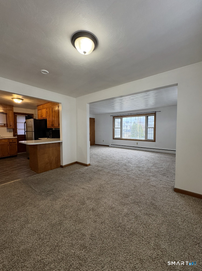 16 Grove Street New London, CT 06320 - Photo 3 of 12 a view of an empty room with a window