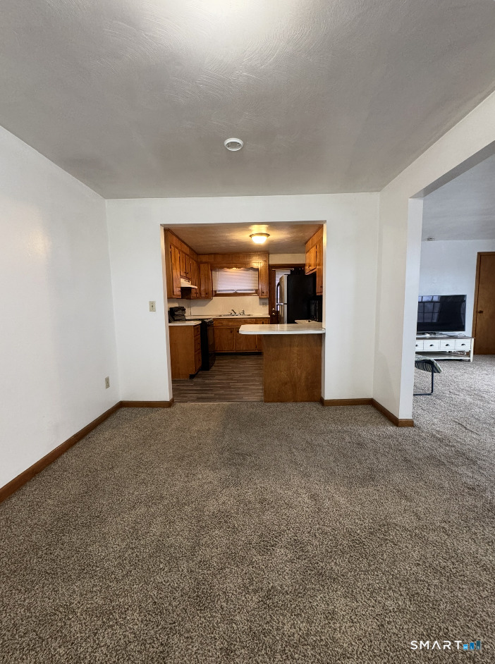 16 Grove Street New London, CT 06320 - Photo 4 of 12 wooden floor in kitchen