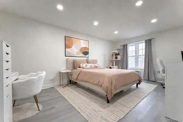 a bedroom with a bed and a chair