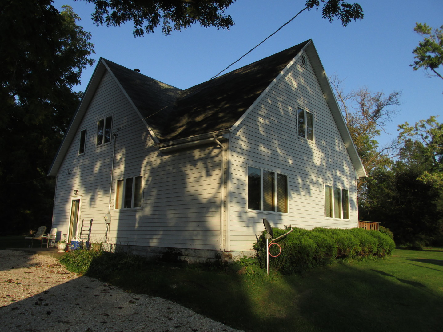 1844 Center Street Lee Center, IL 61310 - Photo 1 of 27 a front view of a house with a yard