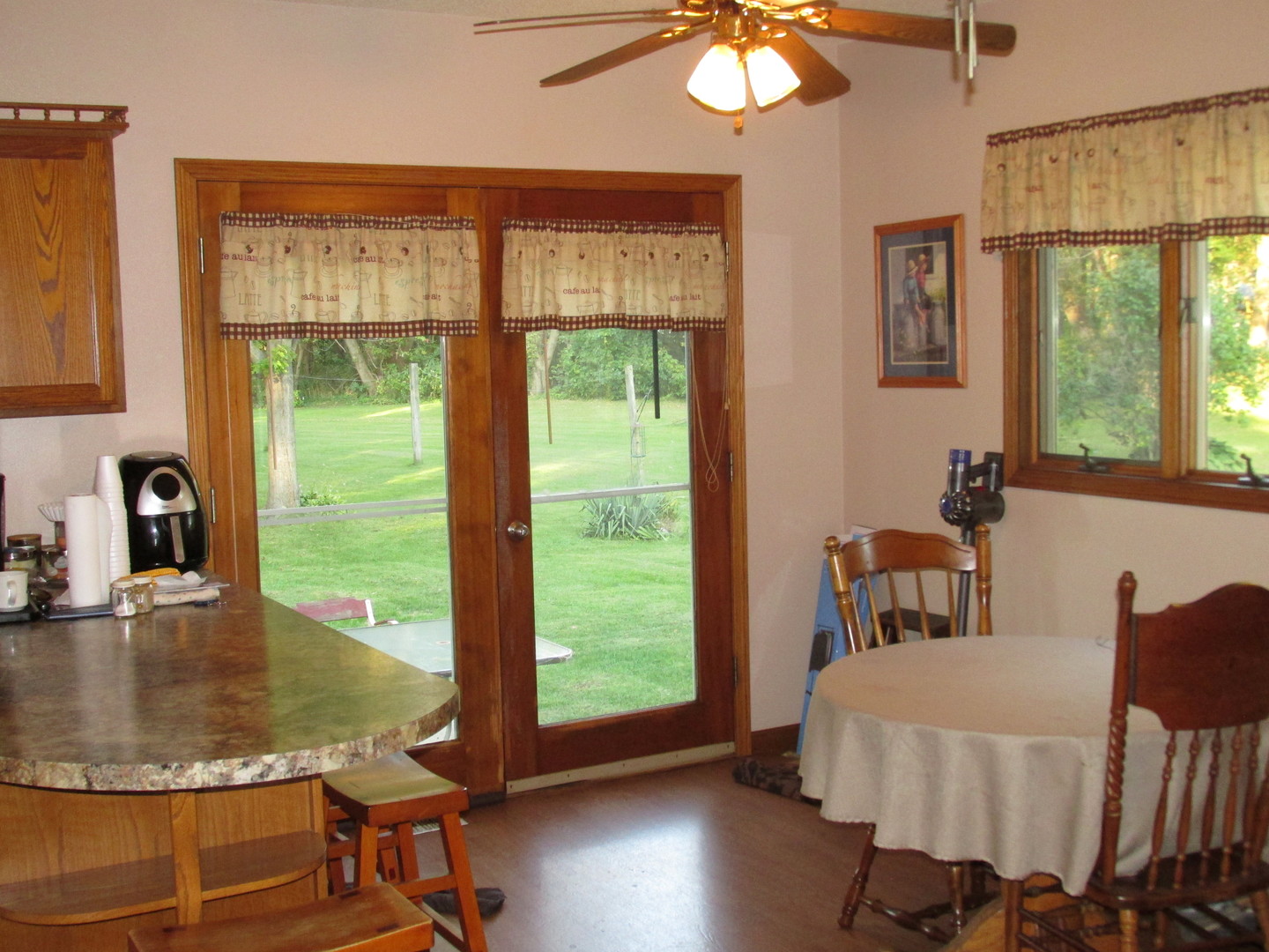 1844 Center Street Lee Center, IL 61310 - Photo 4 of 27 a view of a dining room with furniture window and wooden floor