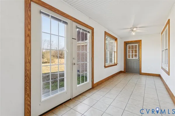 a view of an empty room with windows