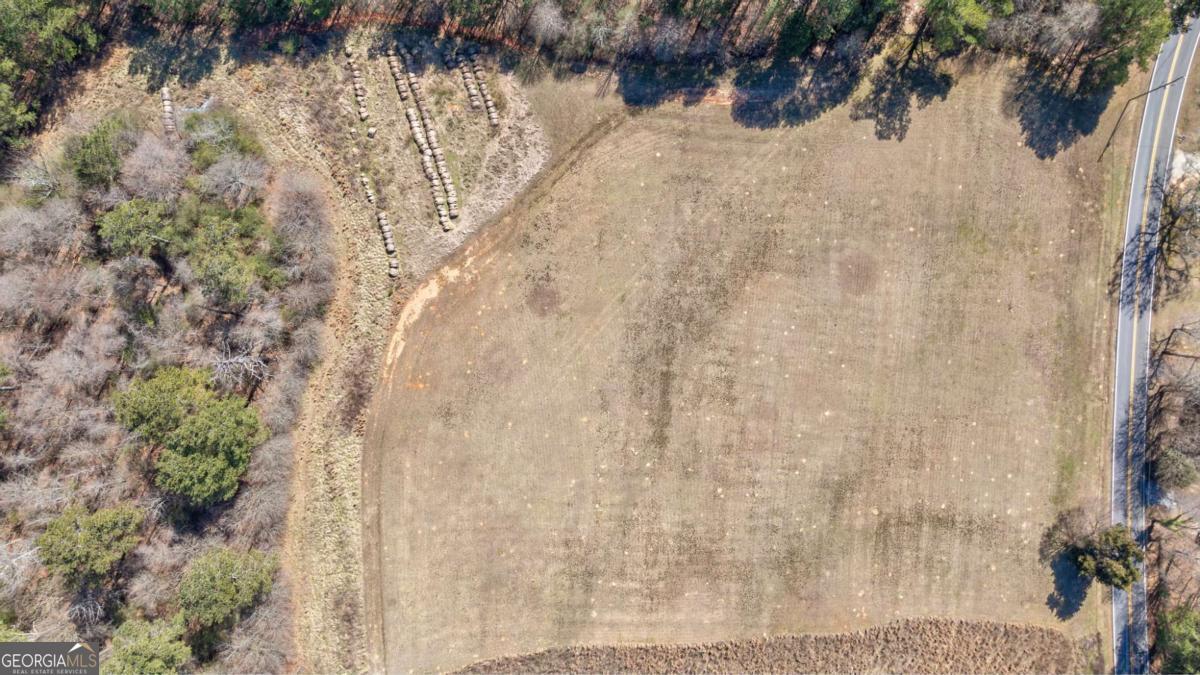 304 Kent Rock Road, Unit TRACT 3 Loganville, GA 30052 - Photo 13 of 16 a view of a yard with wooden fence