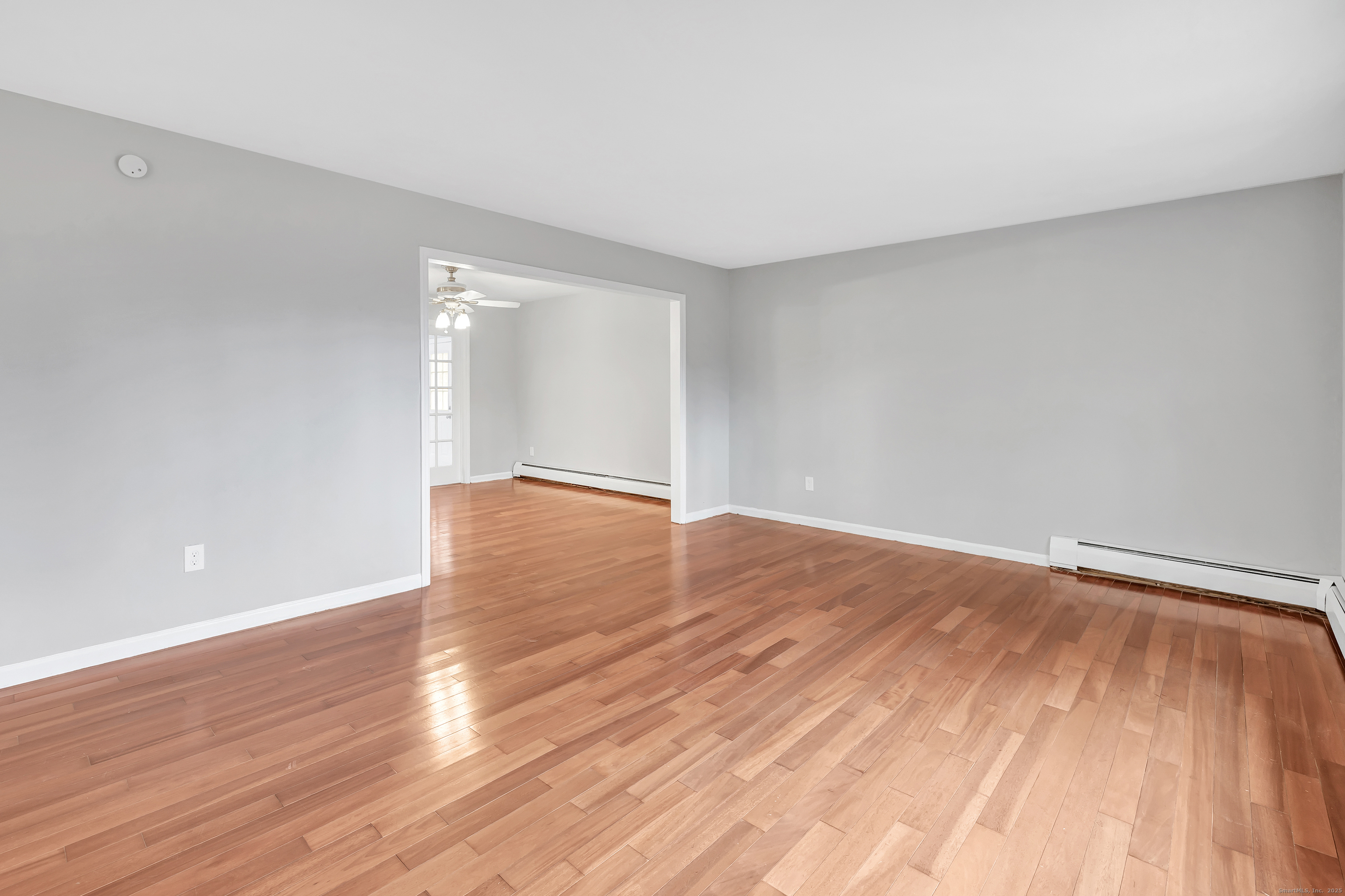 76 Dorman Road Oxford, CT 06478 - Photo 12 of 39 a view of empty room with wooden floor