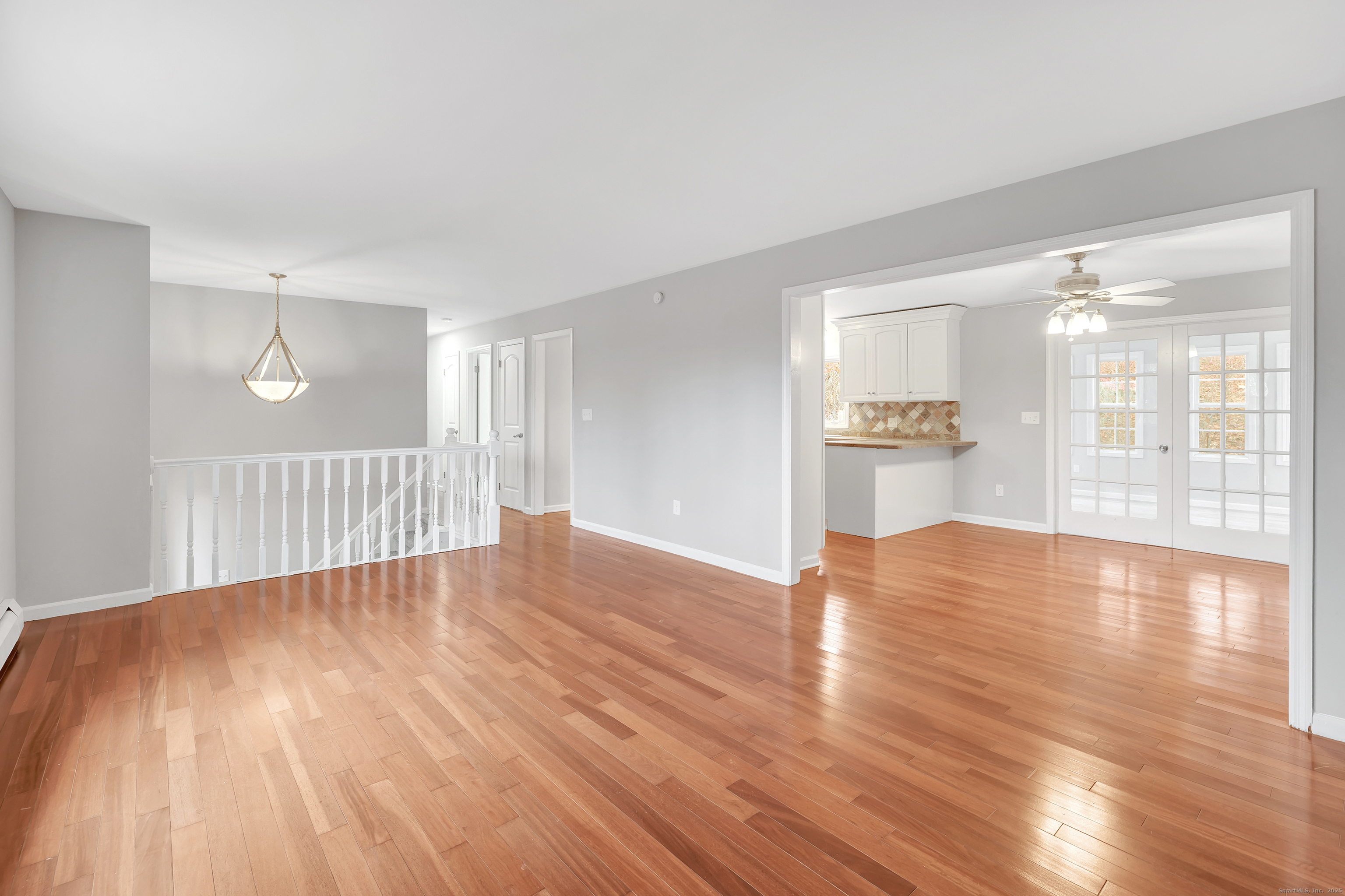 76 Dorman Road Oxford, CT 06478 - Photo 13 of 39 a view of empty room with wooden floor