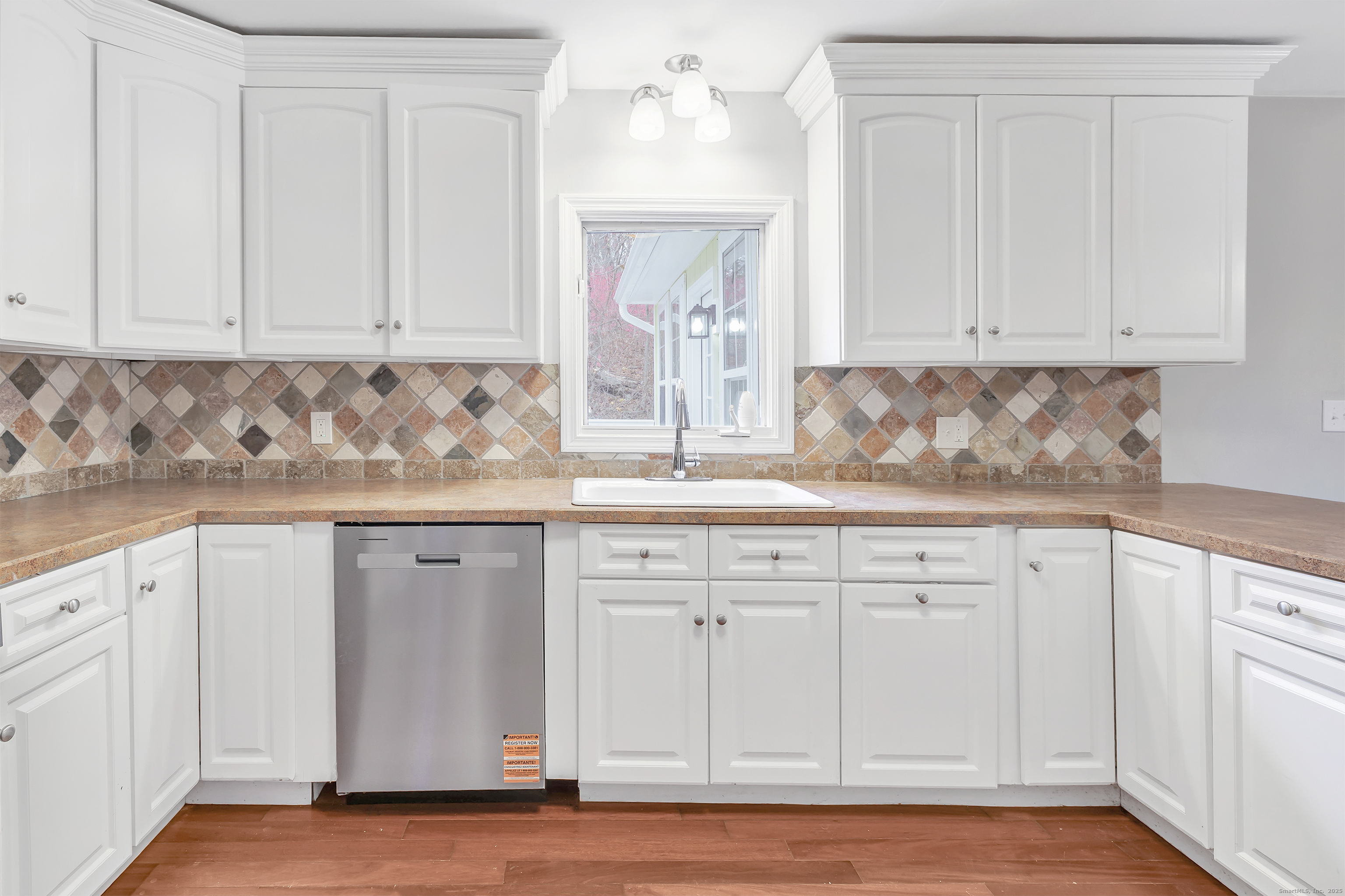 76 Dorman Road Oxford, CT 06478 - Photo 21 of 39 a kitchen with granite countertop white cabinets and sink