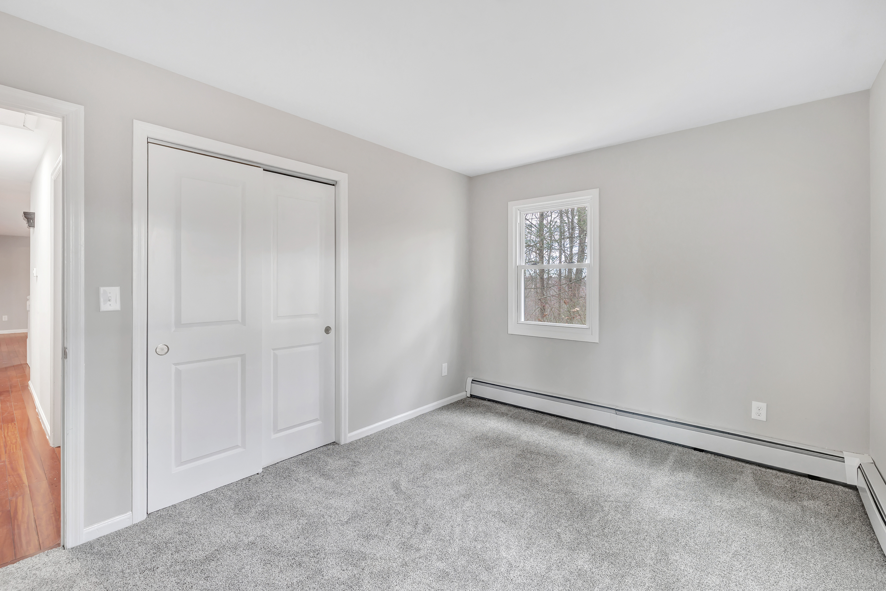 76 Dorman Road Oxford, CT 06478 - Photo 30 of 39 a view of an empty room with a window