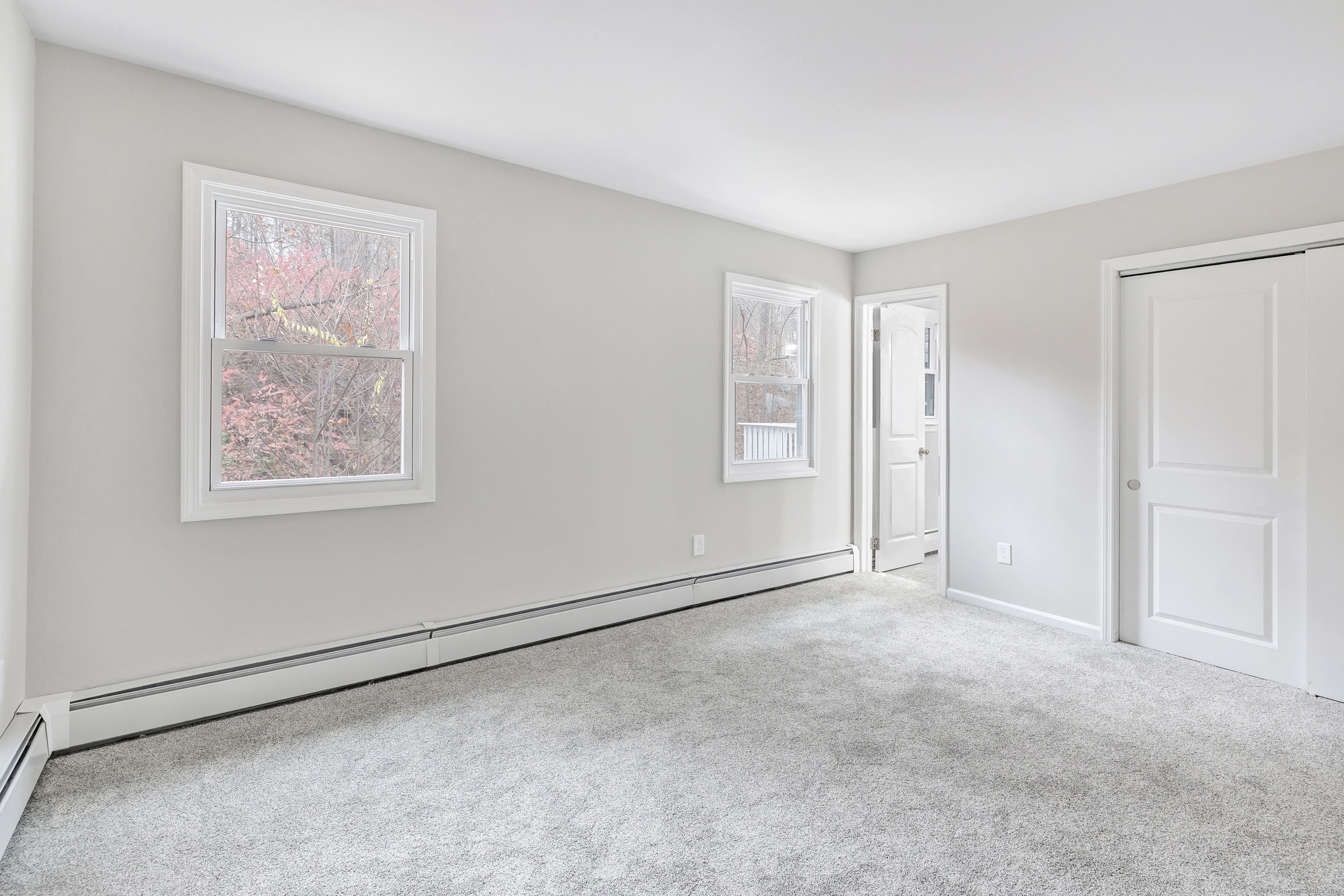 76 Dorman Road Oxford, CT 06478 - Photo 32 of 39 an empty room with windows and closet