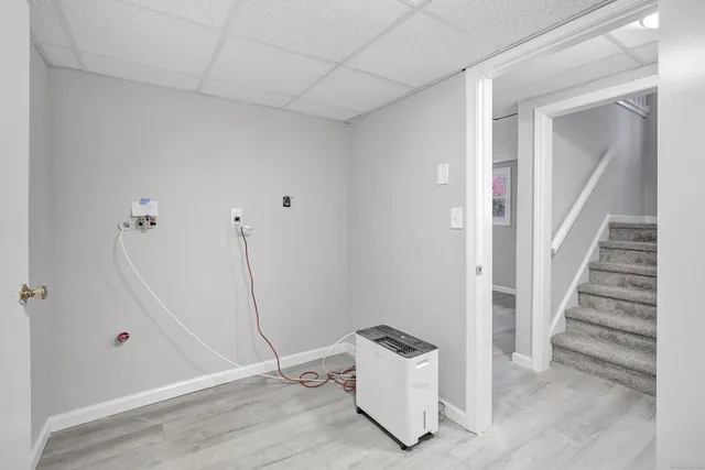 a view of room with stairs and windows