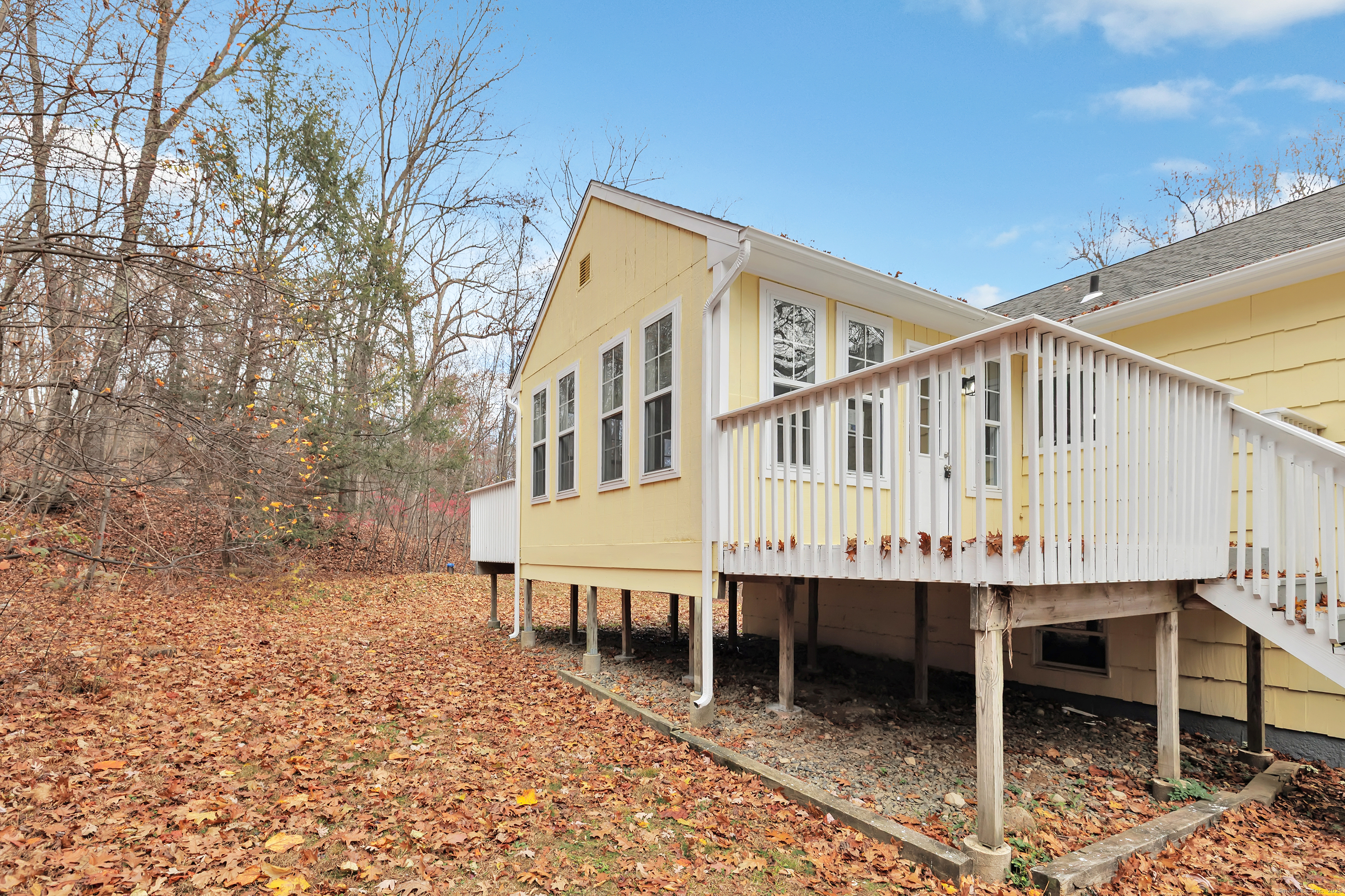 76 Dorman Road Oxford, CT 06478 - Photo 5 of 39 a roof deck with table and chairs