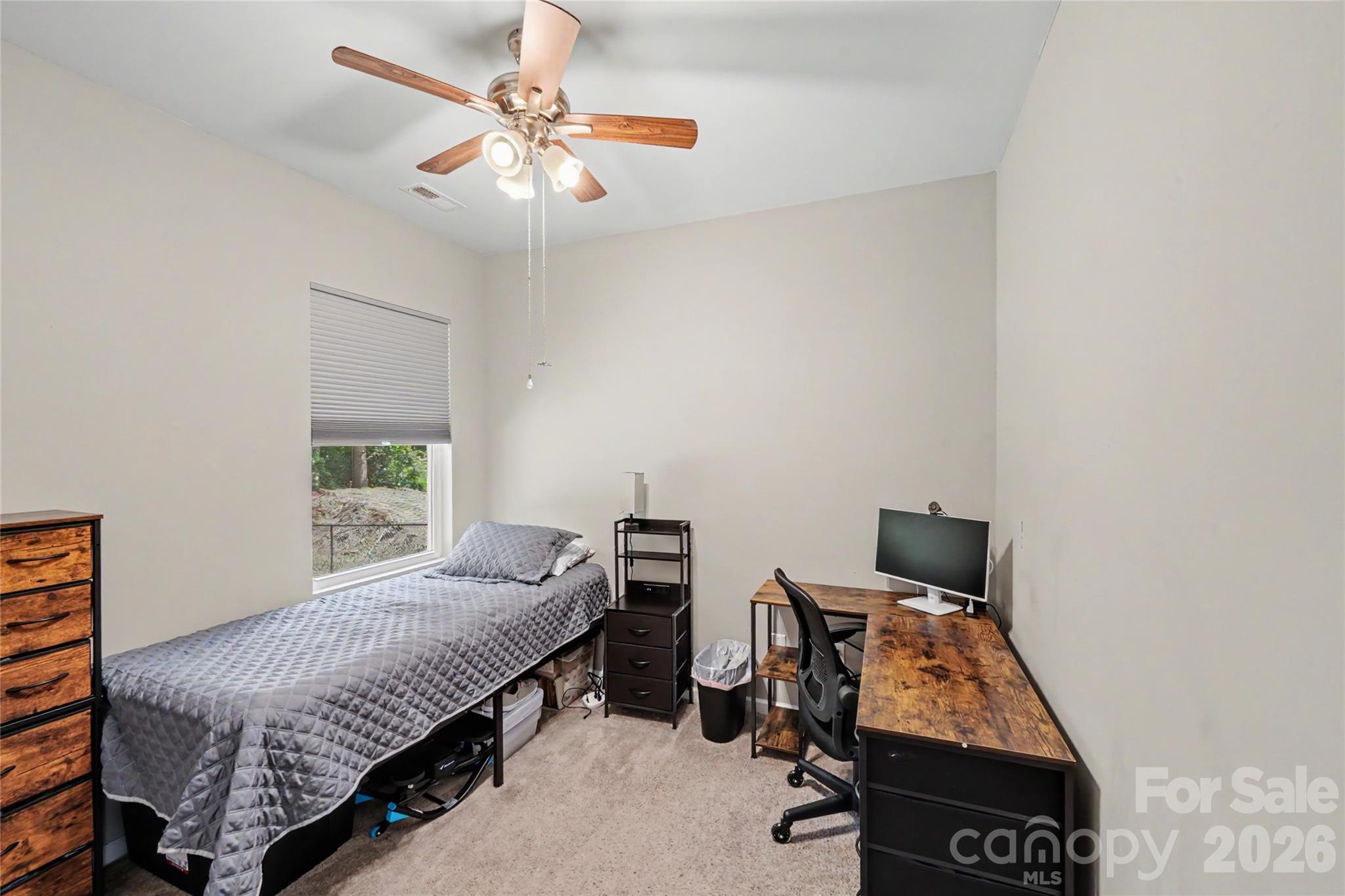 119 Brown Street Clover, SC 29710 - Photo 11 of 24 a bedroom with a bed and a chandelier