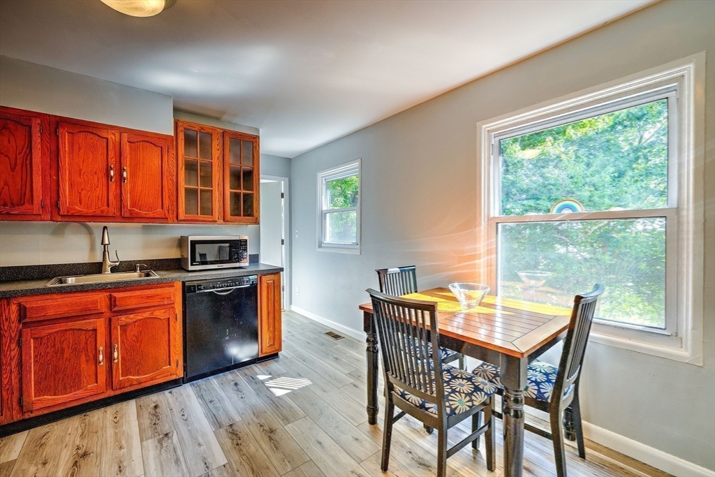 25 Tahanto Road Worcester, MA 01602 - Photo 16 of 35 a kitchen with stainless steel appliances granite countertop wooden cabinets a stove top oven and a dishwasher