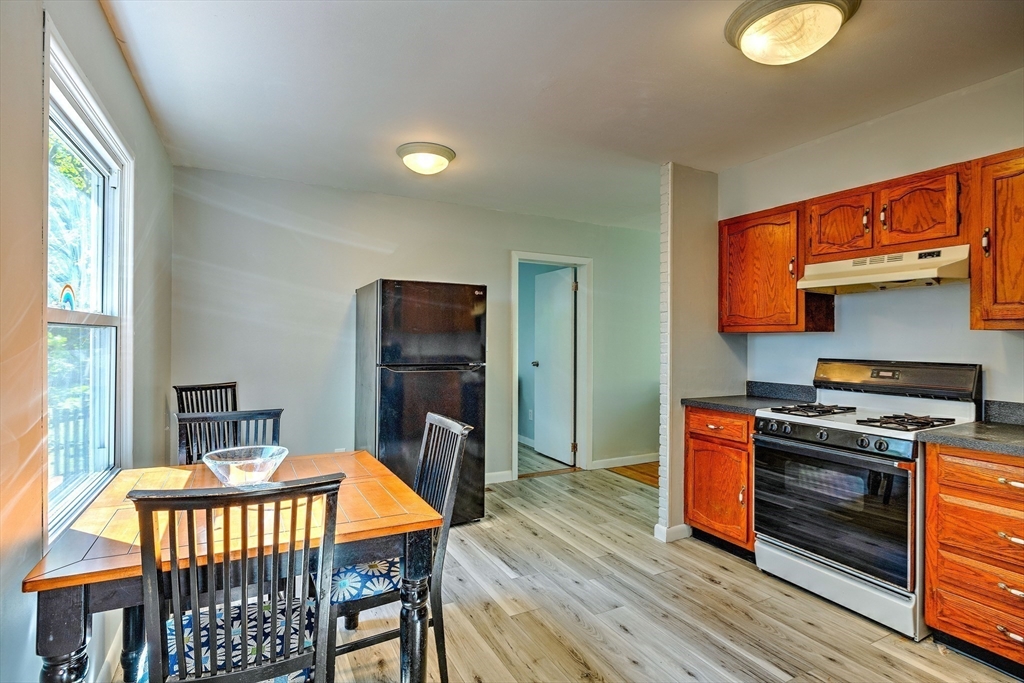 25 Tahanto Road Worcester, MA 01602 - Photo 18 of 35 a kitchen with stainless steel appliances a stove a sink dishwasher and a refrigerator